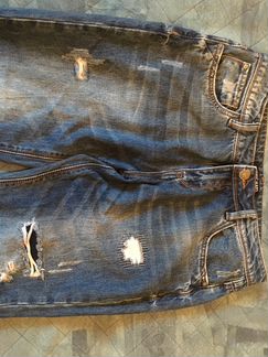 Фирменные рваные джинсы 46 размер